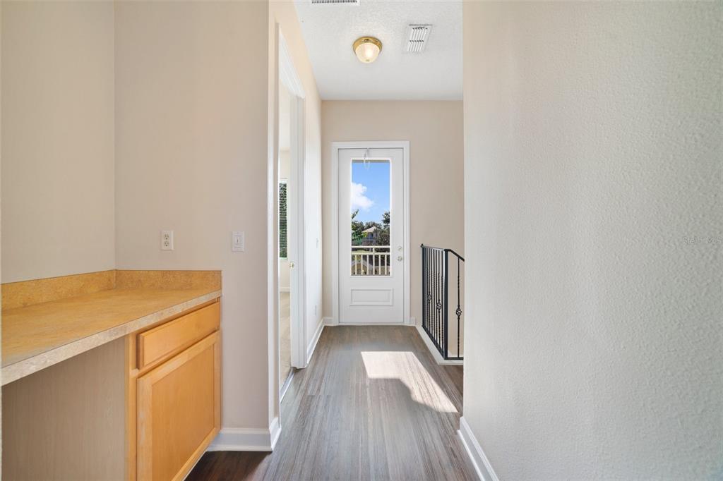 7740 Linkside Loop Reunion, FL 34747 - Photo 15 of 34 a view of hallway with wooden floor