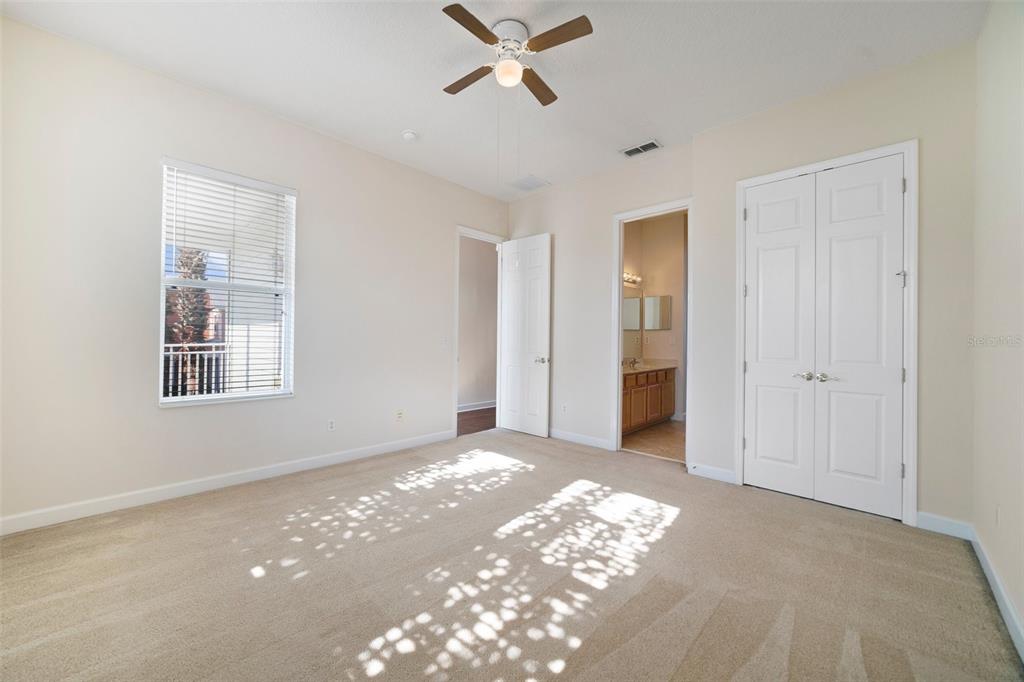 7740 Linkside Loop Reunion, FL 34747 - Photo 17 of 34 a view of a livingroom with a ceiling fan and window