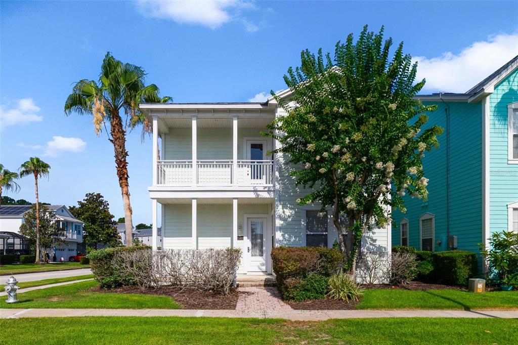 7740 Linkside Loop Reunion, FL 34747 - Photo 2 of 34 a front view of a house with garden