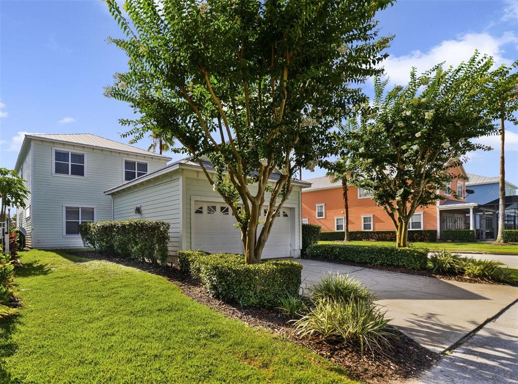 7740 Linkside Loop Reunion, FL 34747 - Photo 30 of 34 a front view of a house with a yard and garage