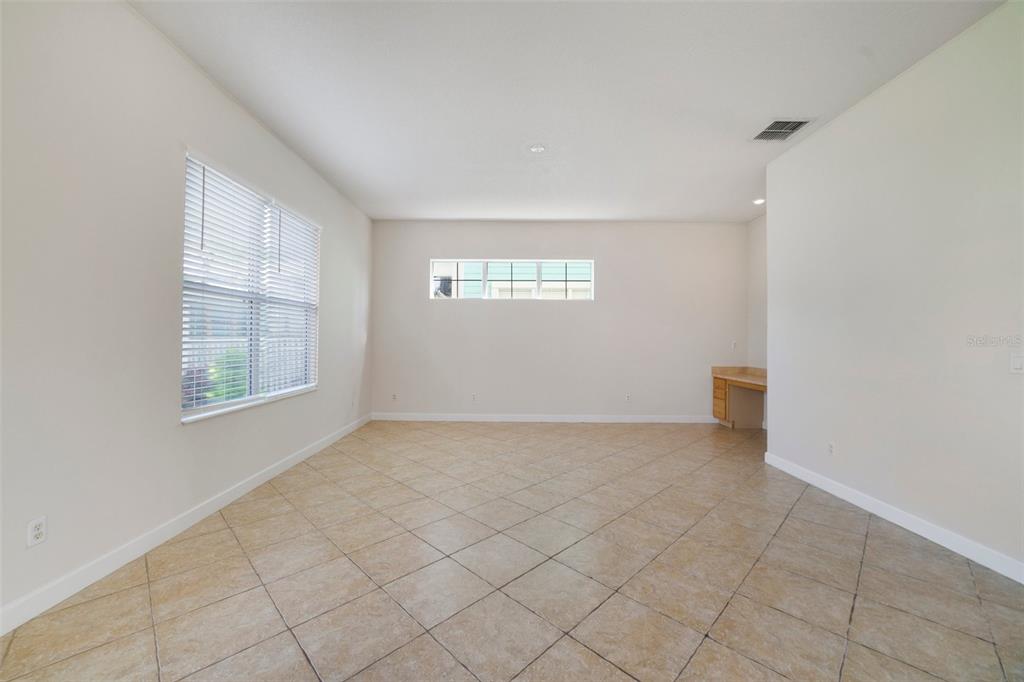 7740 Linkside Loop Reunion, FL 34747 - Photo 4 of 34 an empty room with windows