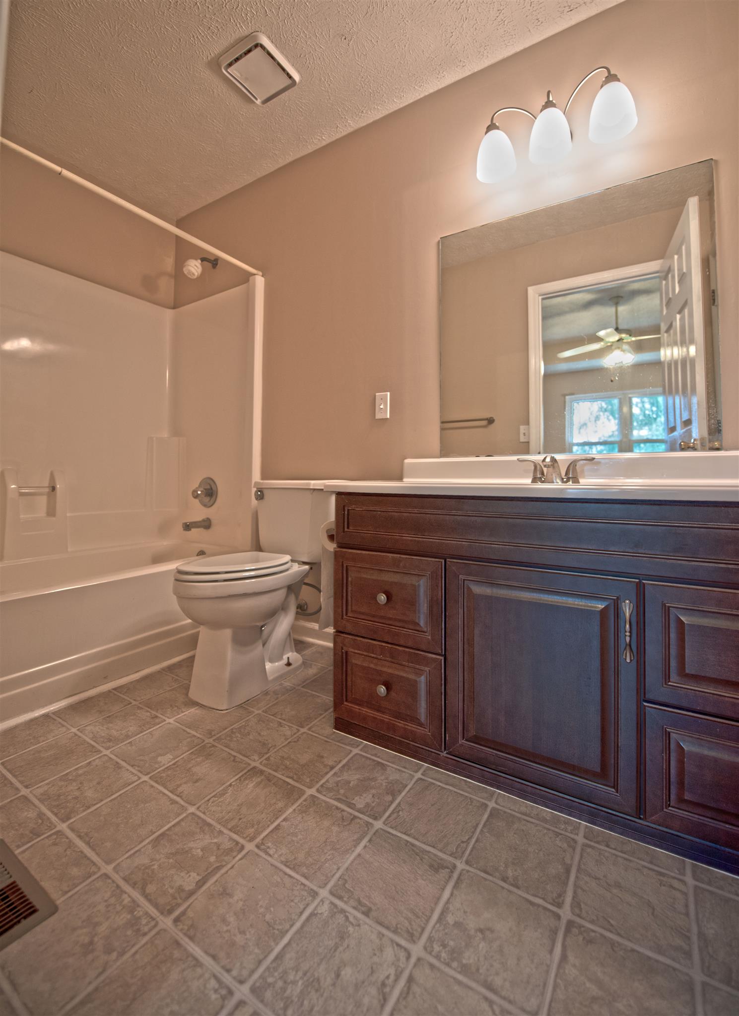7500 Joe Rowlin Road Christiana, TN 37037 - Photo 15 of 22 a bathroom with a sink a toilet and a mirror