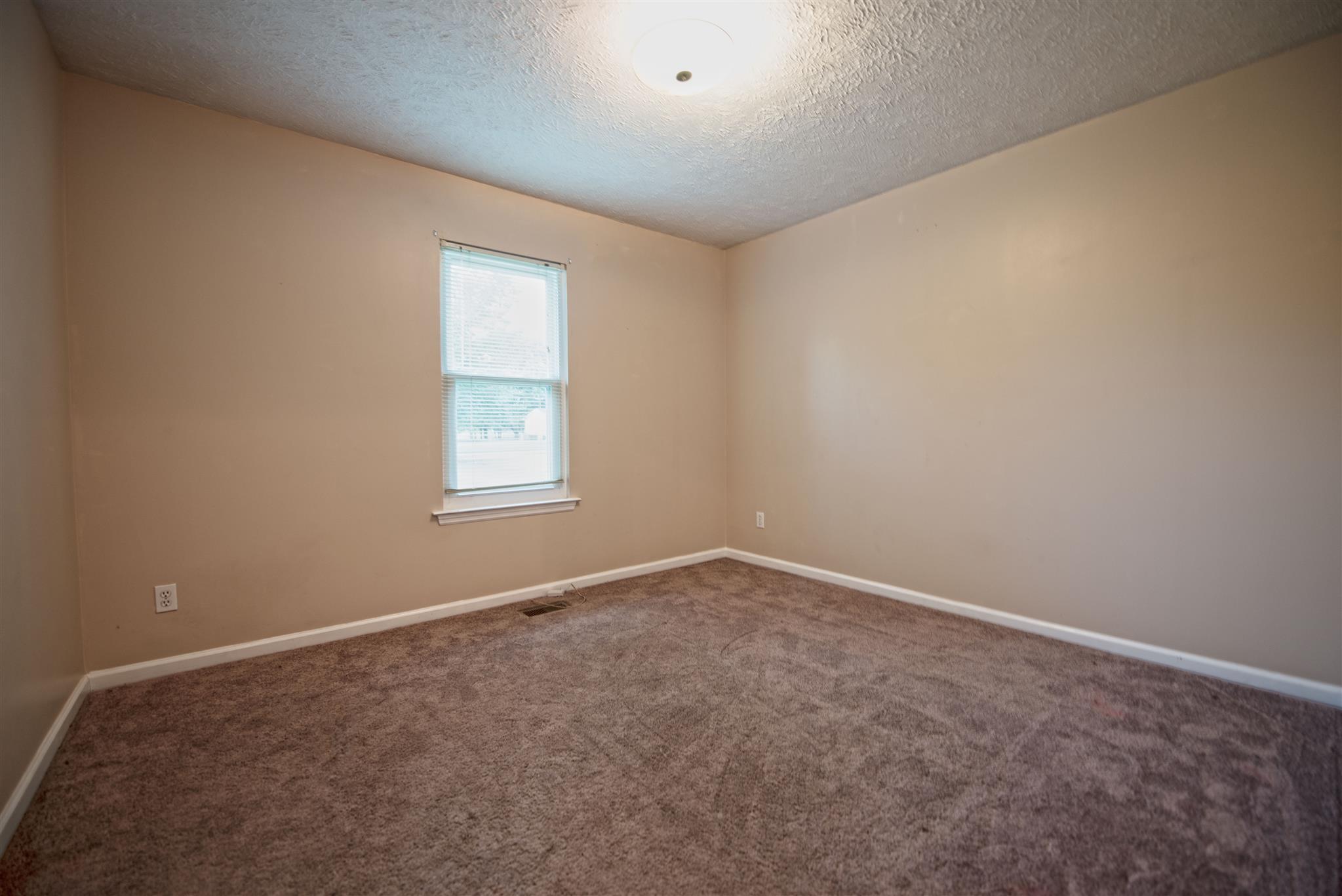 7500 Joe Rowlin Road Christiana, TN 37037 - Photo 16 of 22 an empty room with a window