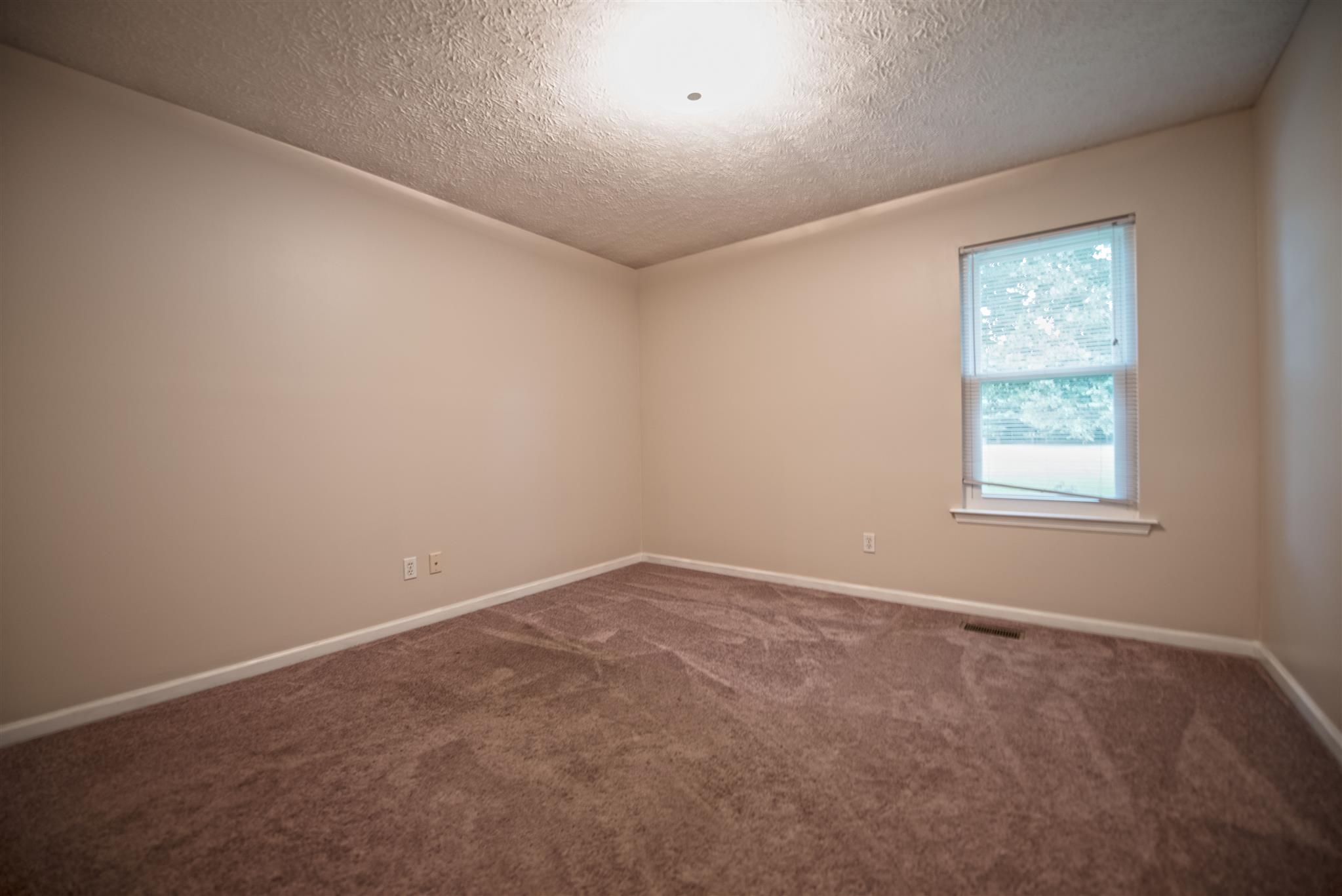 7500 Joe Rowlin Road Christiana, TN 37037 - Photo 18 of 22 an empty room with windows