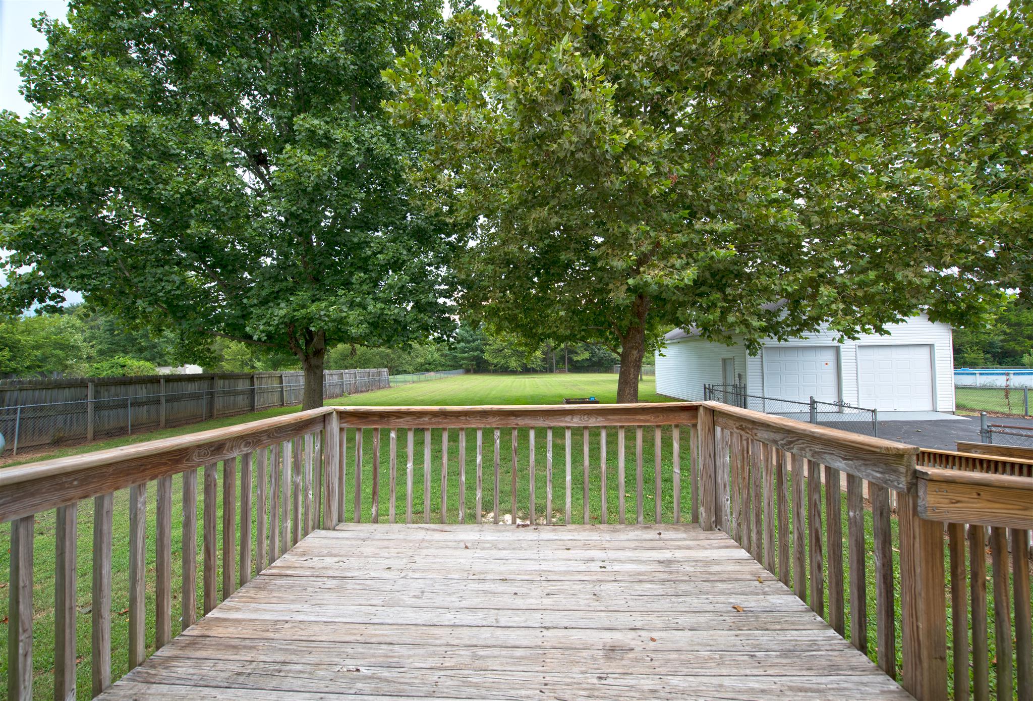 7500 Joe Rowlin Road Christiana, TN 37037 - Photo 19 of 22 a view of deck with wooden floor and fence