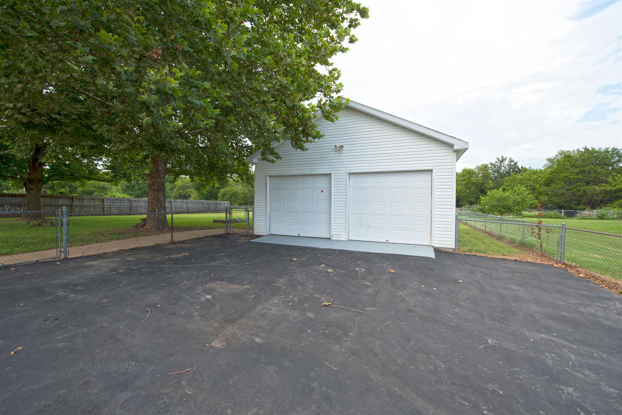 7500 Joe Rowlin Road Christiana, TN 37037 - Photo 3 of 22 a view of a house with backyard and trees