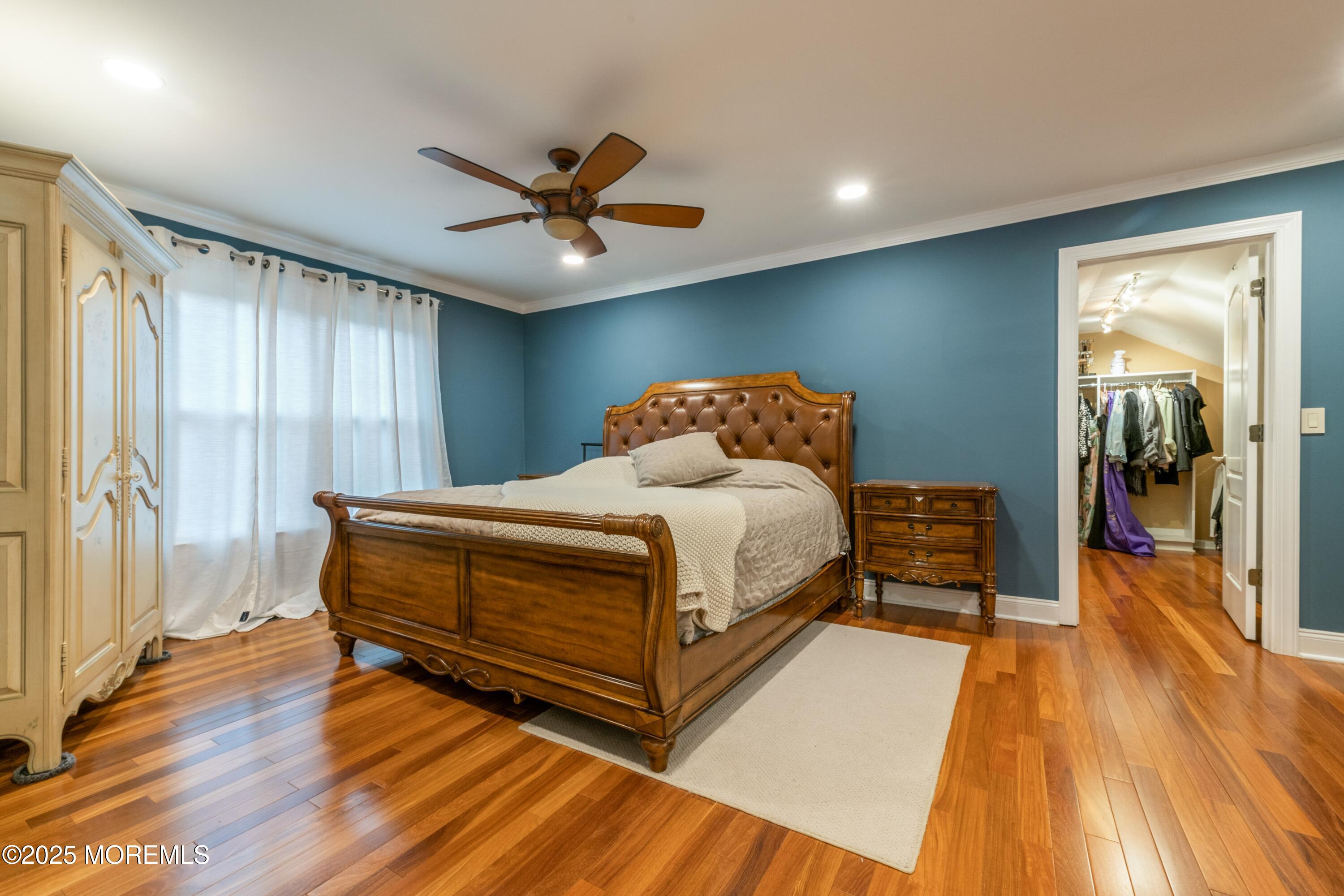 44 Manor Drive Marlboro, NJ 07746 - Photo 14 of 26 a bedroom with a bed and wooden floor