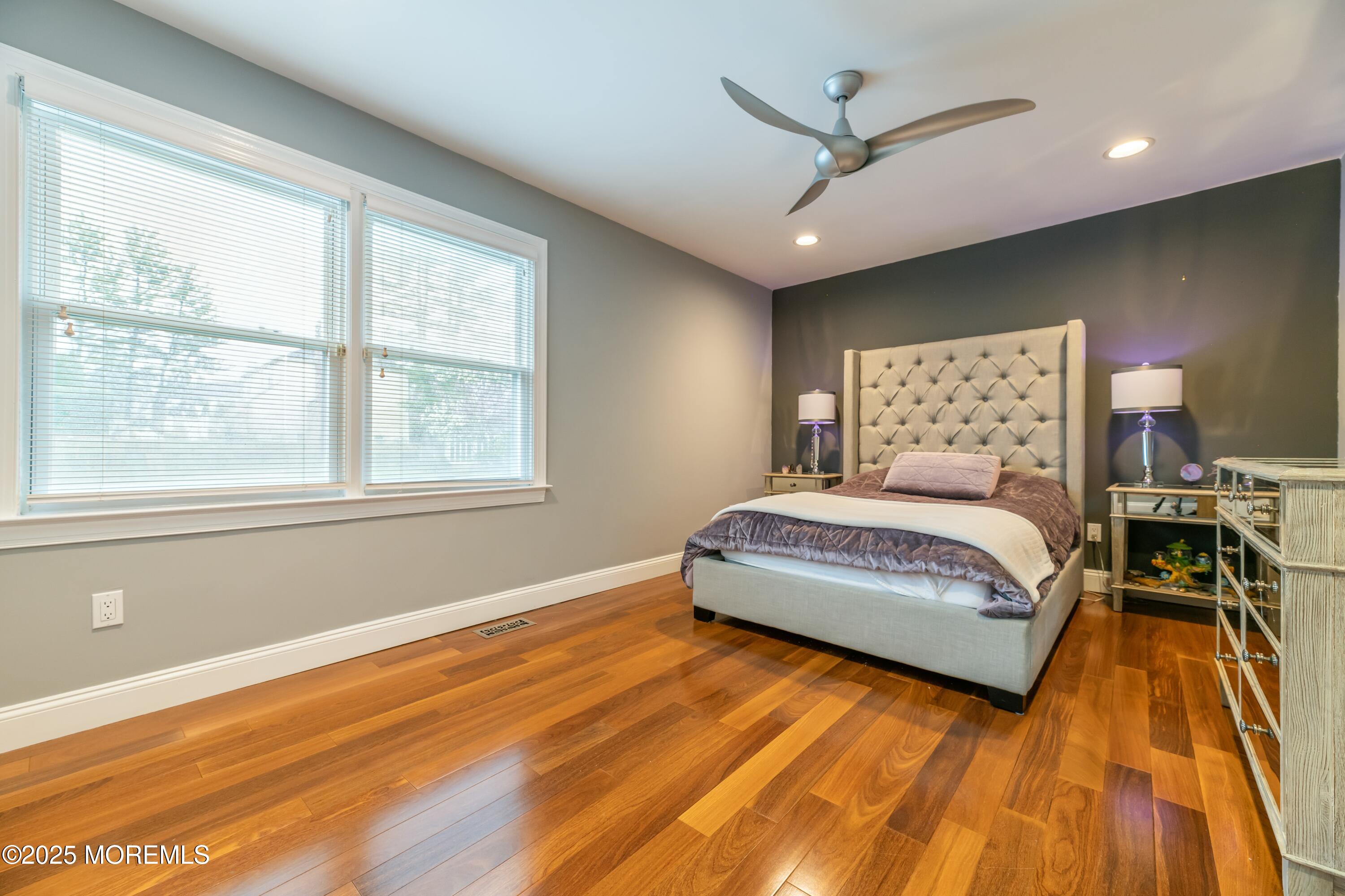 44 Manor Drive Marlboro, NJ 07746 - Photo 16 of 26 a bedroom with a large bed and a large window