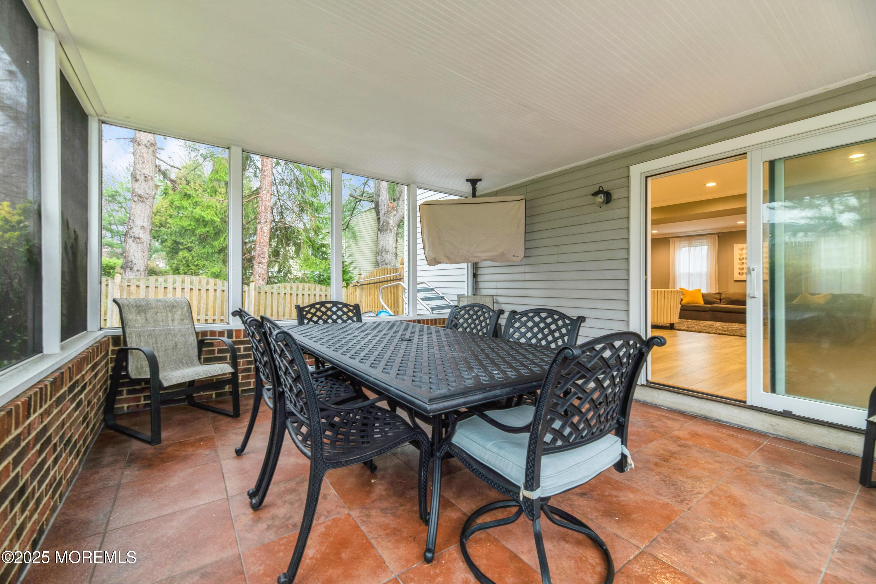 44 Manor Drive Marlboro, NJ 07746 - Photo 21 of 26 a view of a dining room with furniture window and outside view