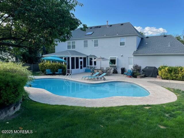 44 Manor Drive Marlboro, NJ 07746 - Photo 22 of 26 a view of a house with pool and a garden