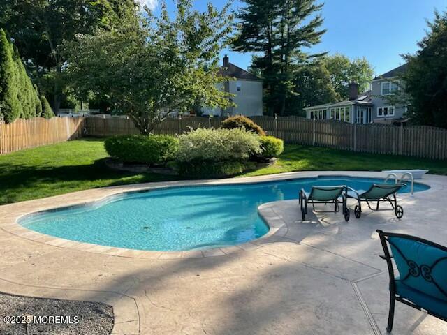 44 Manor Drive Marlboro, NJ 07746 - Photo 23 of 26 a view of a swimming pool with a yard and a sitting area