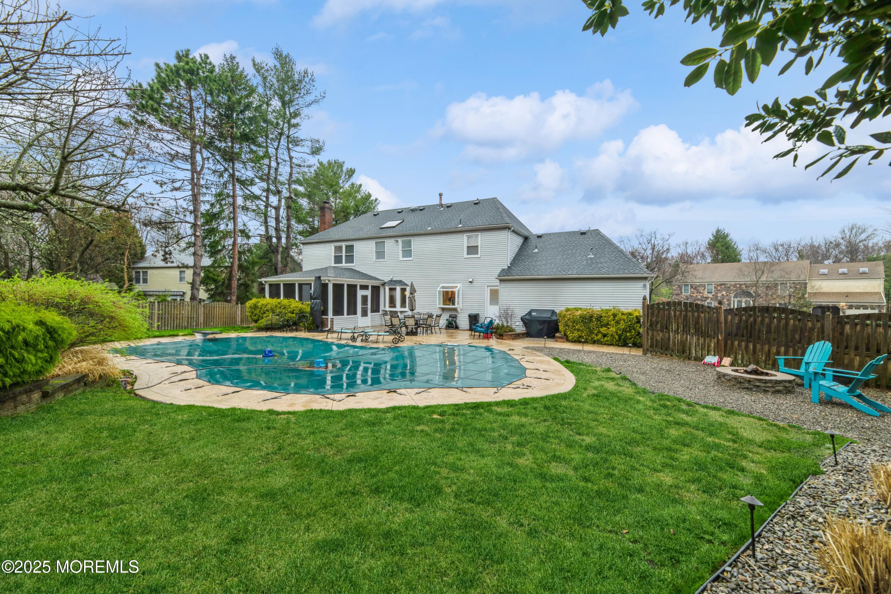44 Manor Drive Marlboro, NJ 07746 - Photo 25 of 26 a view of a house with a big yard potted plants and large tree