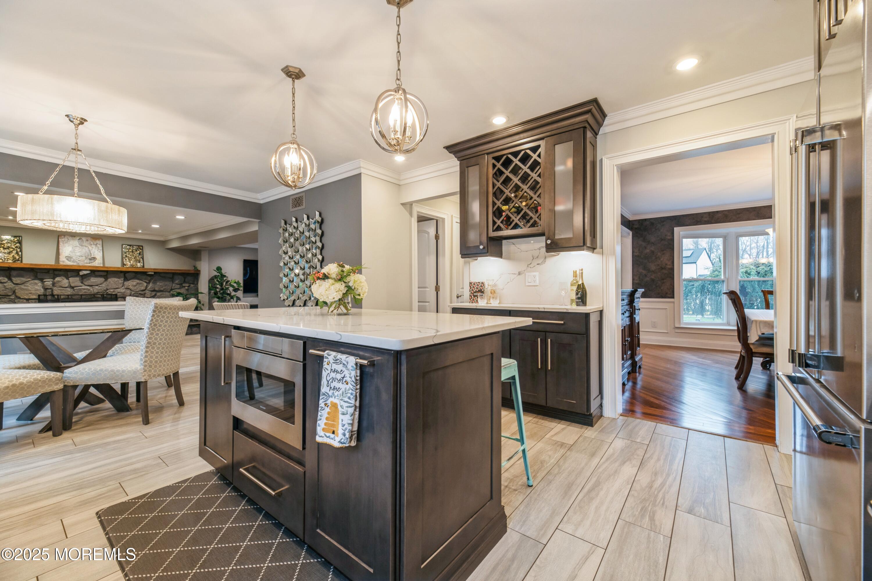 44 Manor Drive Marlboro, NJ 07746 - Photo 7 of 26 a kitchen with stainless steel appliances granite countertop a stove and cabinets