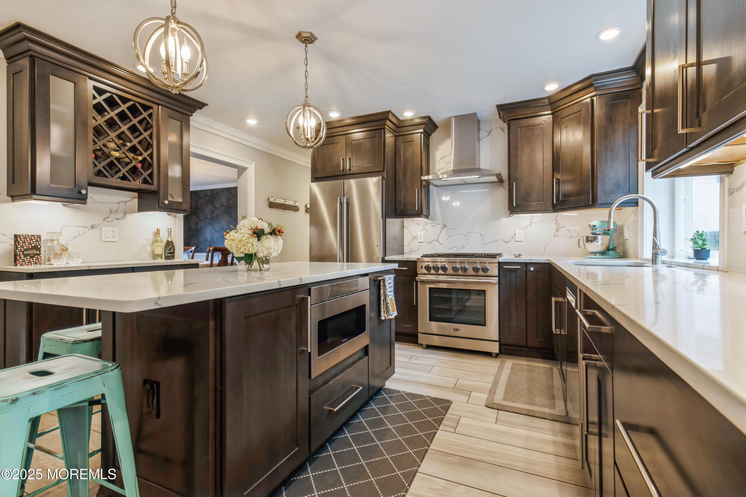 44 Manor Drive Marlboro, NJ 07746 - Photo 8 of 26 a kitchen with stainless steel appliances granite countertop a stove and a sink