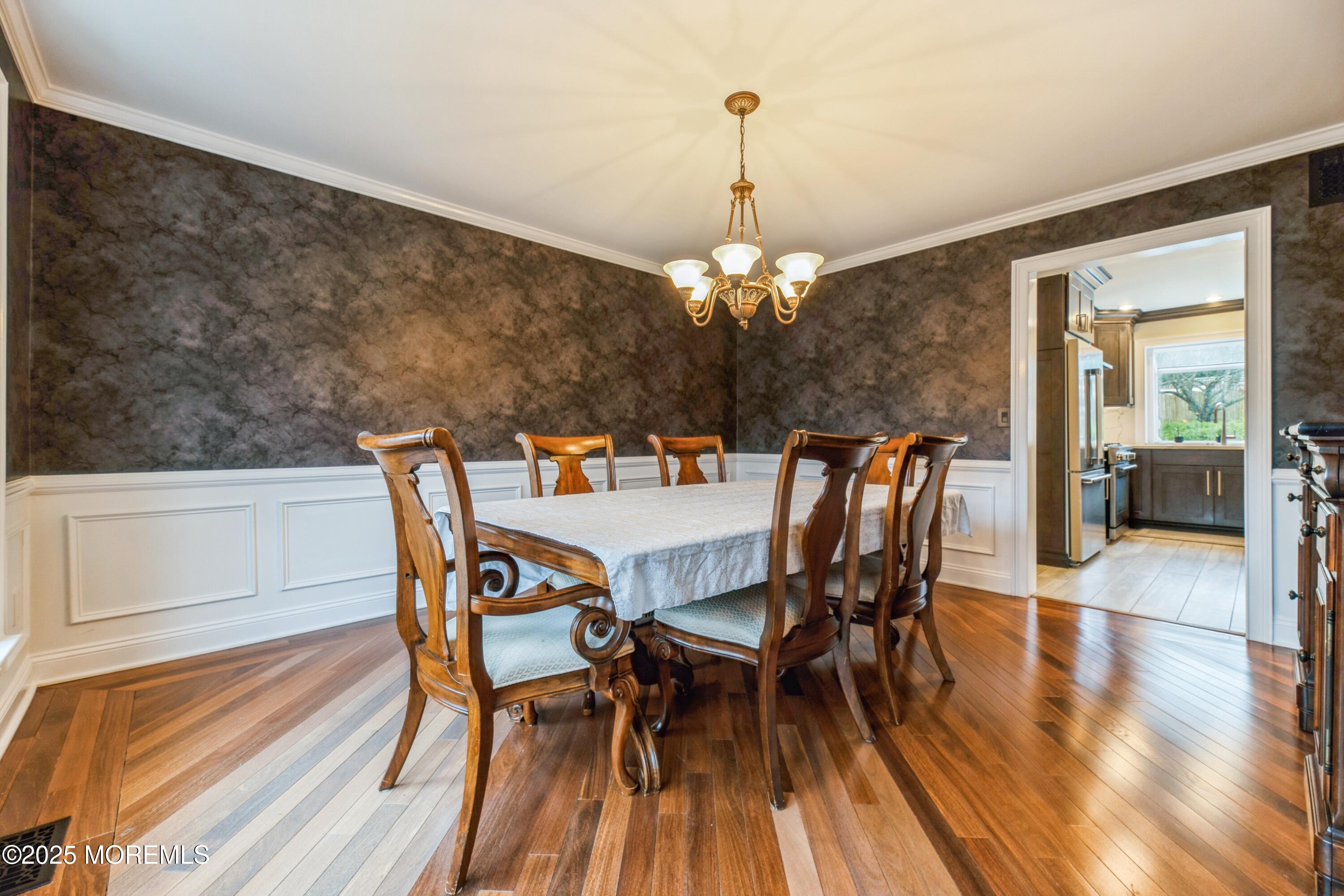 44 Manor Drive Marlboro, NJ 07746 - Photo 10 of 26 a view of a dining room with furniture and wooden floor