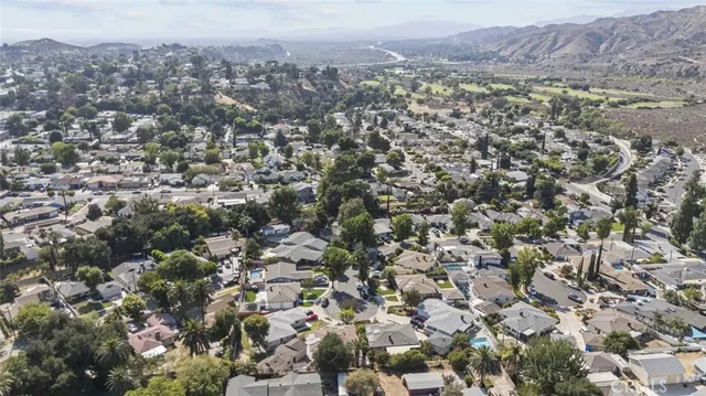 an aerial view of residential house and green space