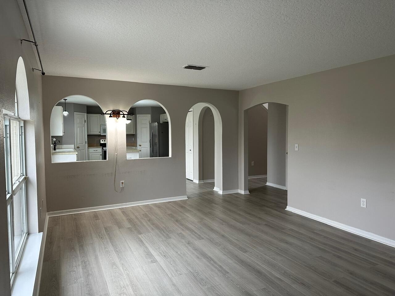 3844 La Flor Drive Rockledge, FL 32955 - Photo 12 of 32 a view of empty room with wooden floor