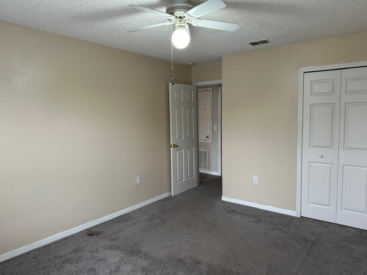 3844 La Flor Drive Rockledge, FL 32955 - Photo 14 of 32 an empty room with a fan and a fan