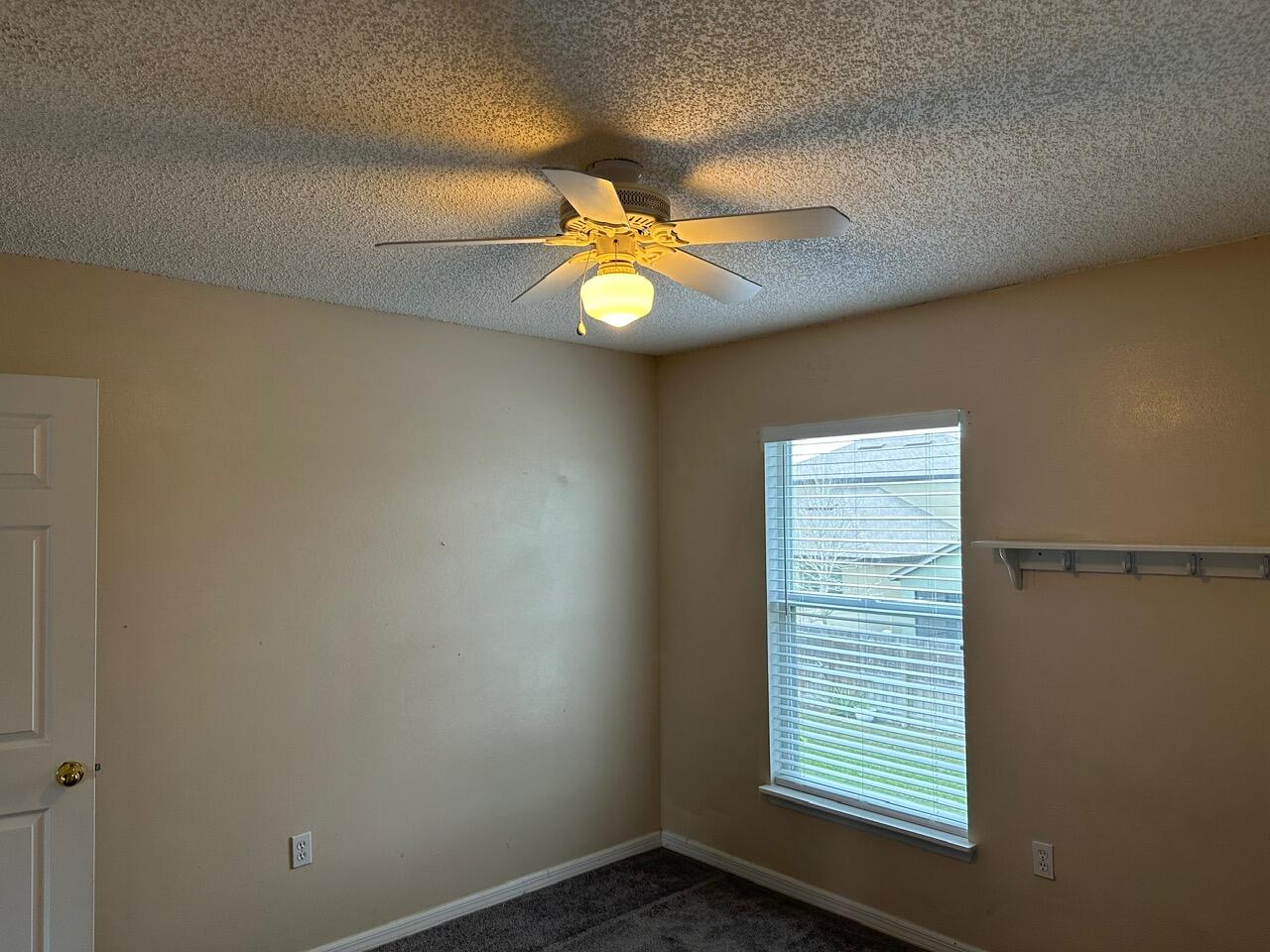 3844 La Flor Drive Rockledge, FL 32955 - Photo 16 of 32 an empty room with windows and chandelier fan