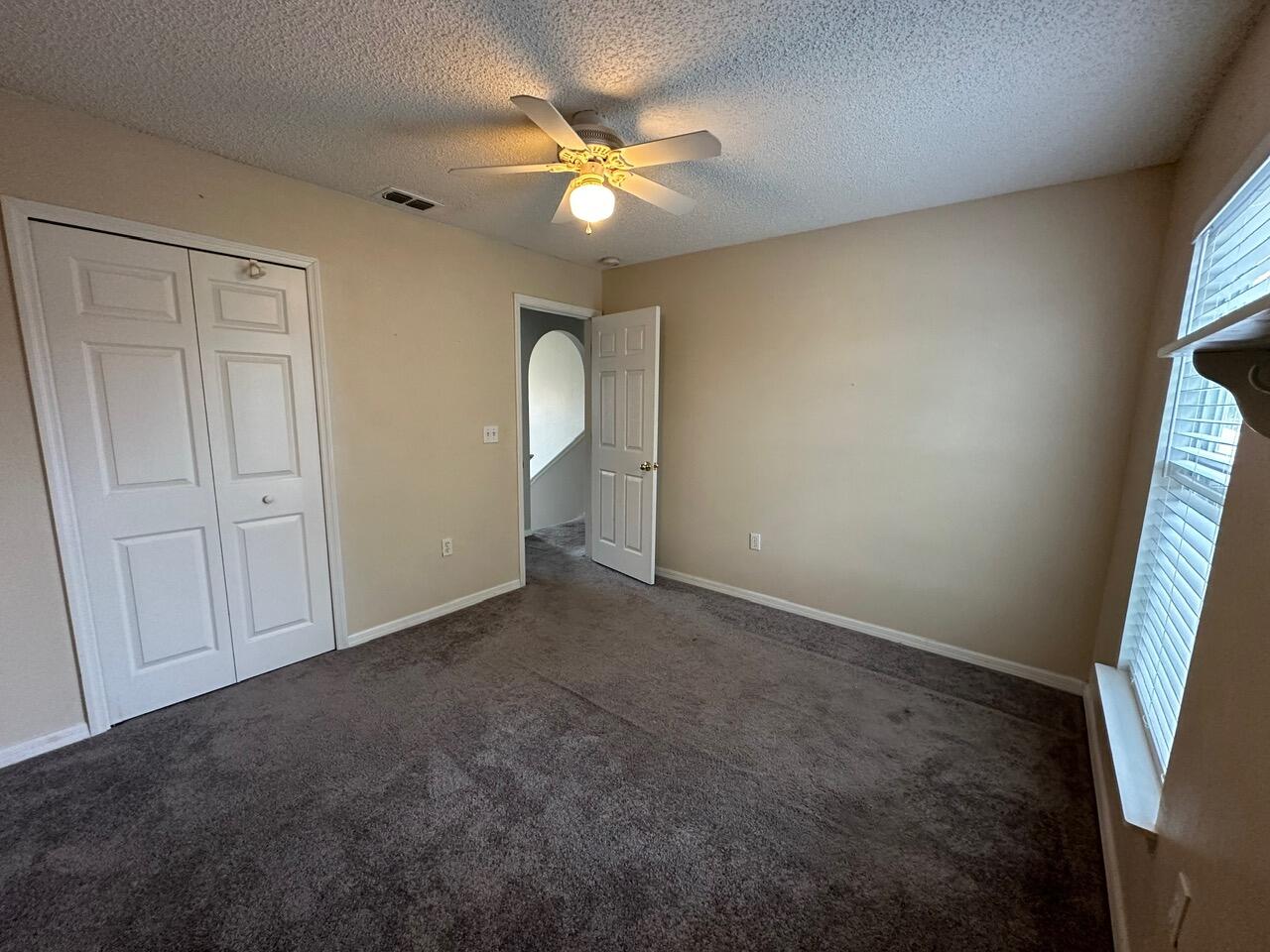3844 La Flor Drive Rockledge, FL 32955 - Photo 17 of 32 an empty room with windows and fan