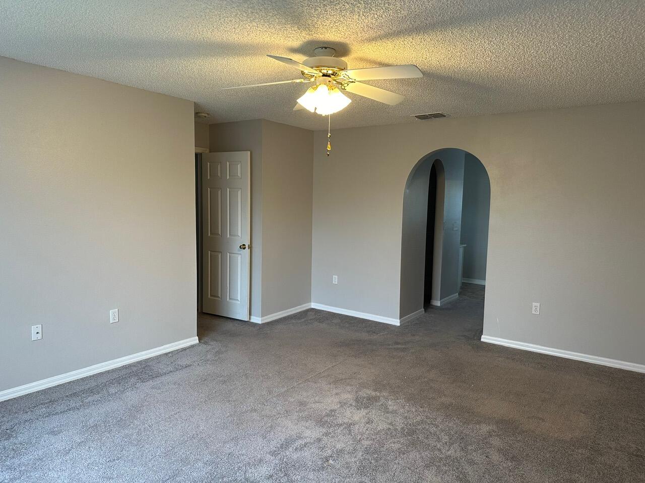 3844 La Flor Drive Rockledge, FL 32955 - Photo 22 of 32 a view of an empty room with a chandelier fan