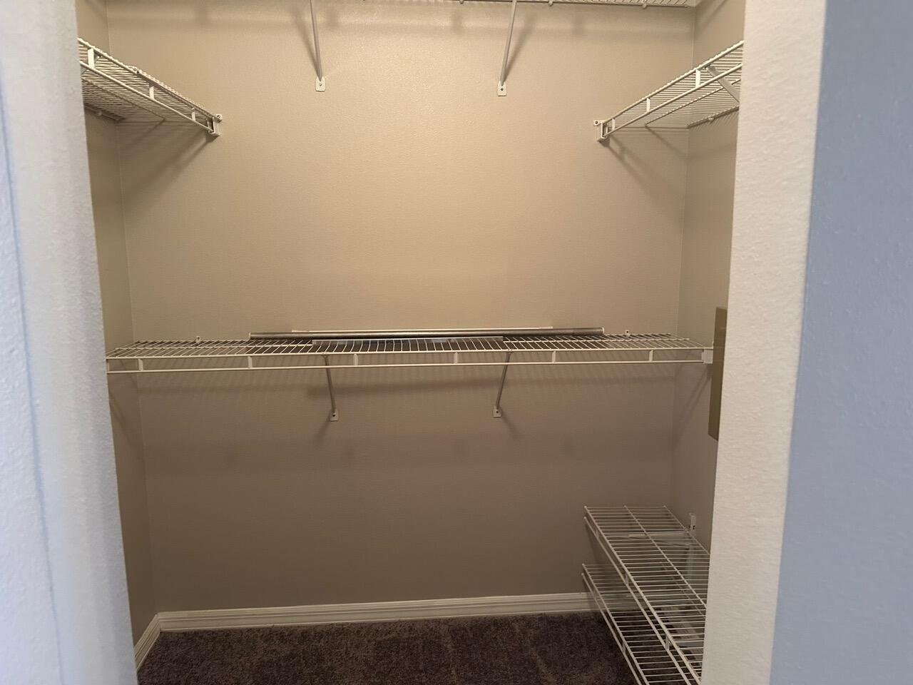 3844 La Flor Drive Rockledge, FL 32955 - Photo 26 of 32 a view of a room with racks on the wall