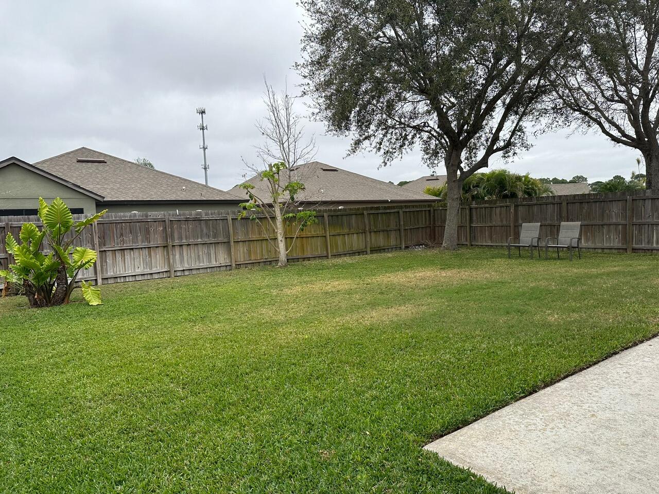 3844 La Flor Drive Rockledge, FL 32955 - Photo 32 of 32 a view of a backyard with a garden and trees
