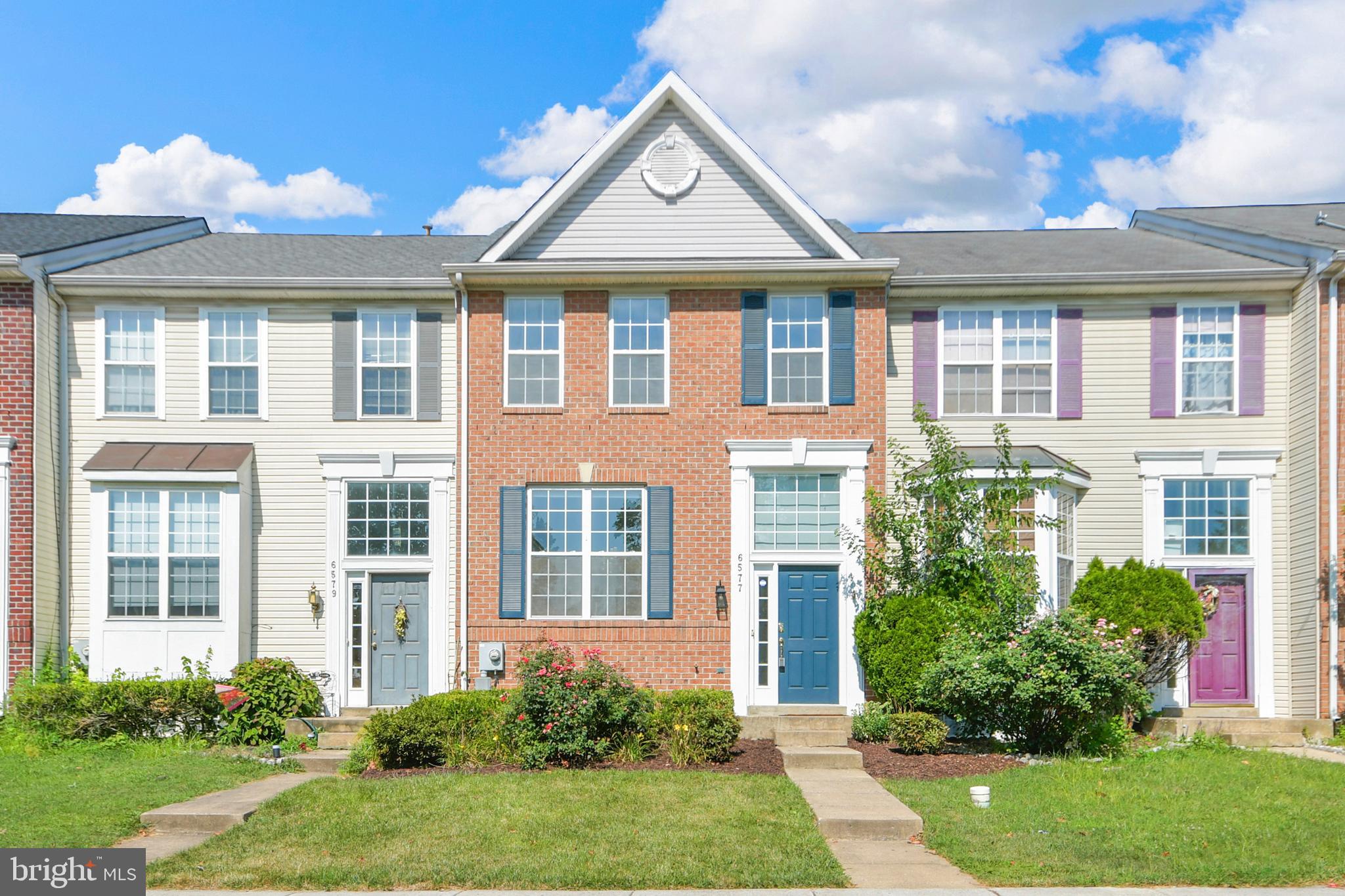 6577 Duncan Place Frederick, MD 21703 - Photo 2 of 10 a front view of a house with garden