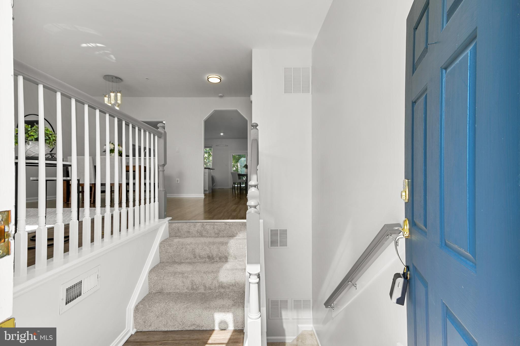 6577 Duncan Place Frederick, MD 21703 - Photo 10 of 10 a view of a hallway with wooden floor and staircase