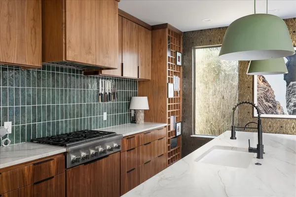 a kitchen with a sink and a stove