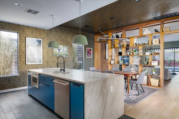 a view of a house with swimming pool and sitting area