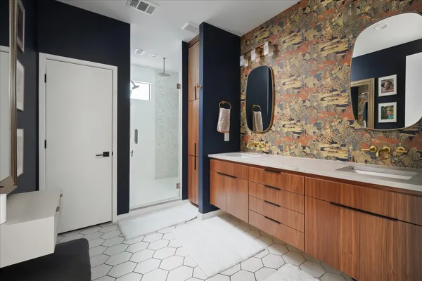 a open kitchen with stainless steel appliances a large window in it