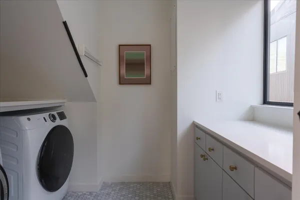 a bed room with a bed and a chair