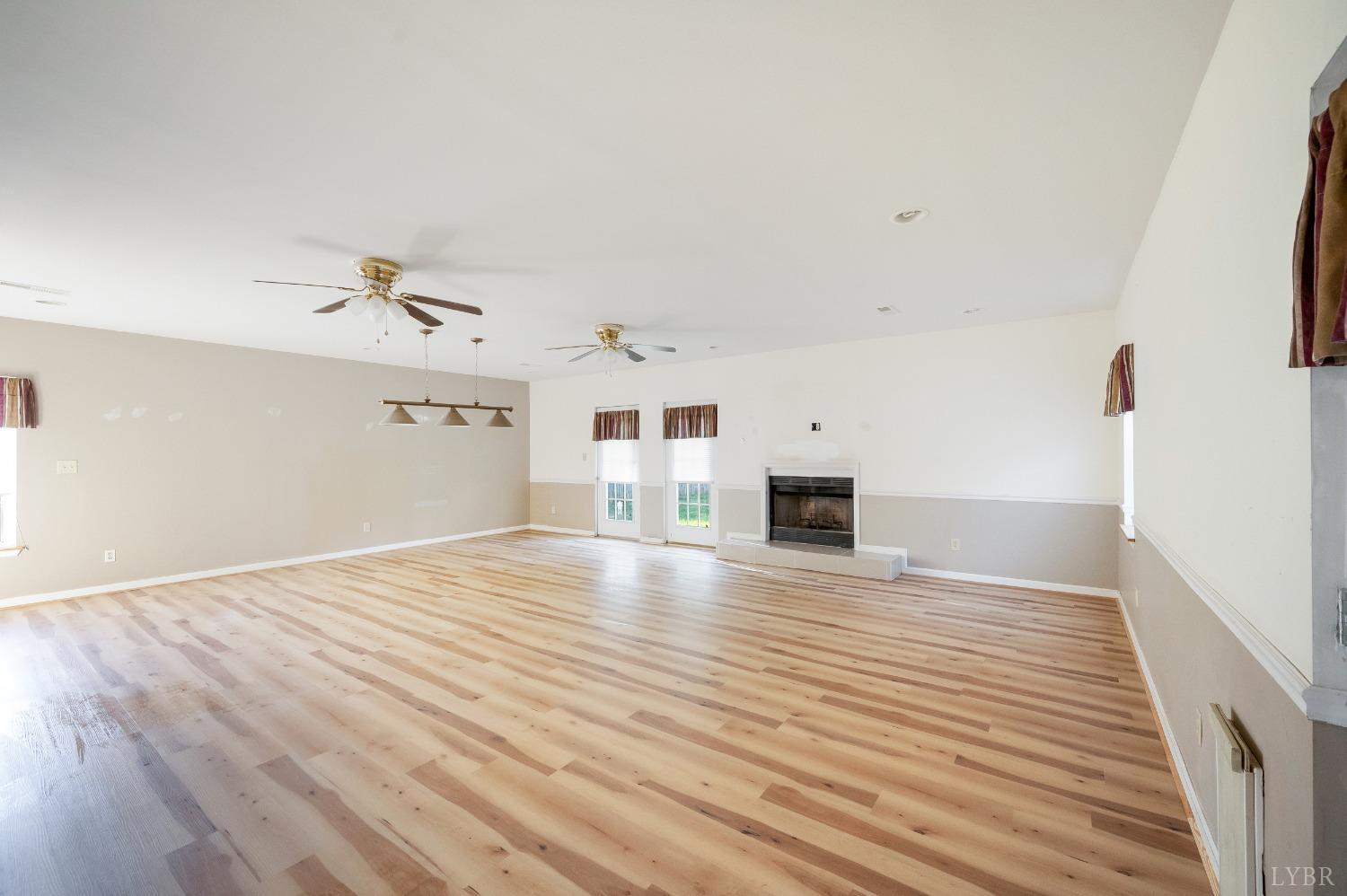 29 Dunivan Drive Rustburg, VA 24588 - Photo 14 of 61 a view of a livingroom with wooden floor and staircase