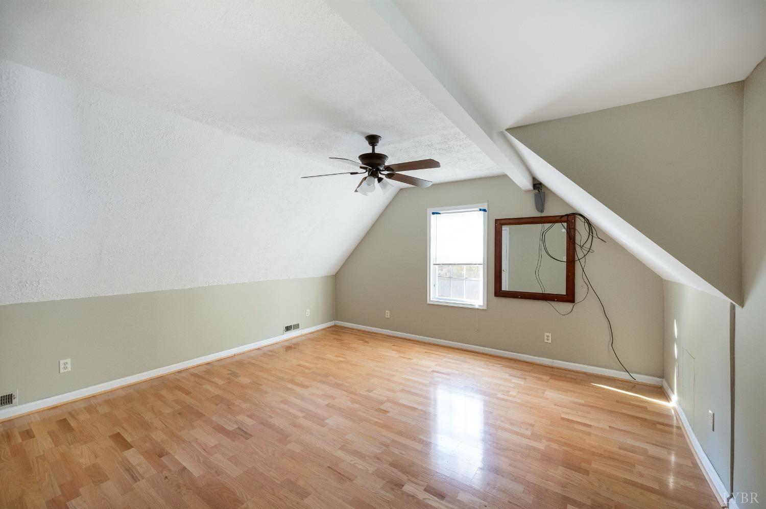 29 Dunivan Drive Rustburg, VA 24588 - Photo 32 of 61 a view of an empty room with wooden floor and a window