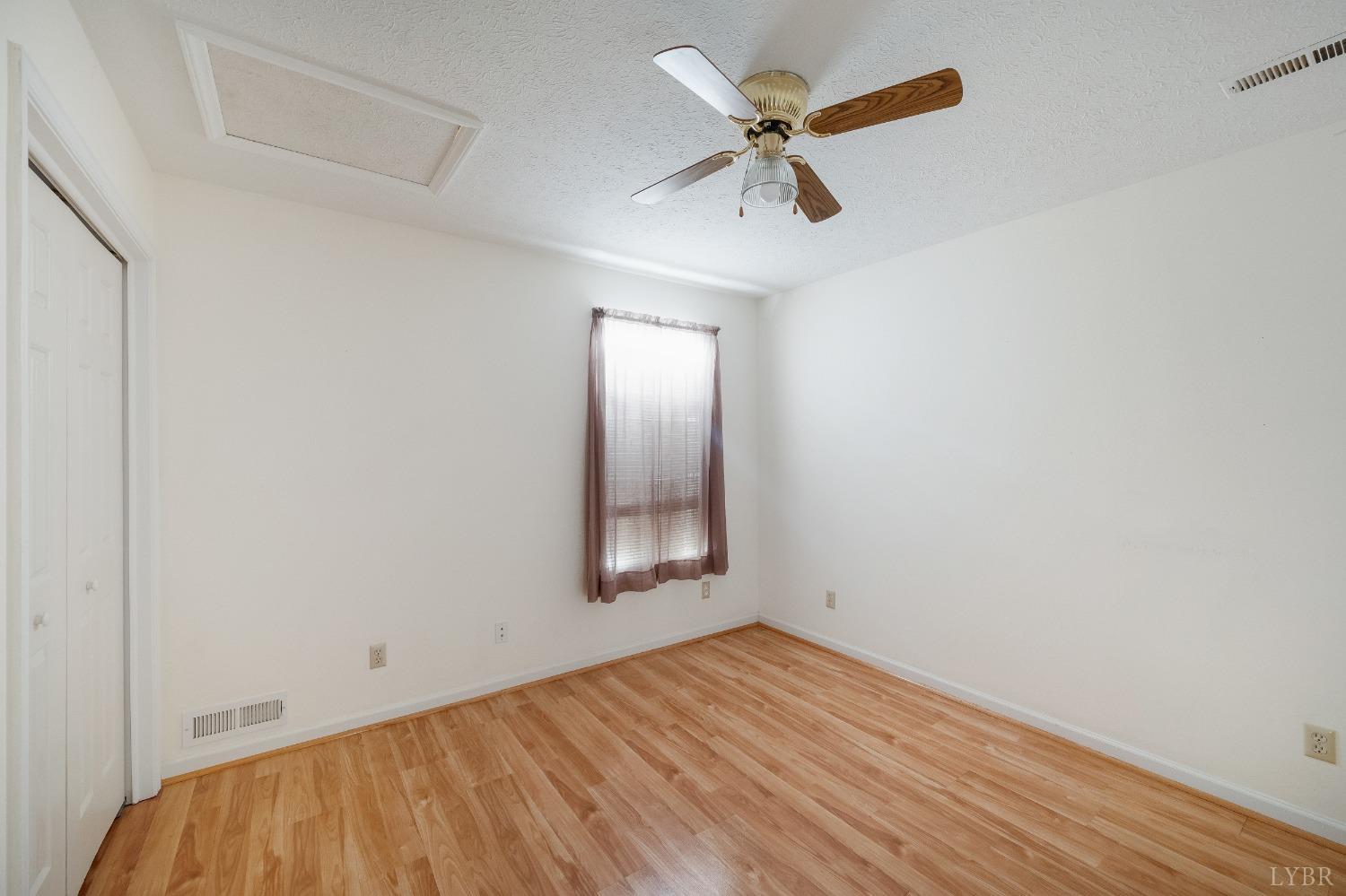 29 Dunivan Drive Rustburg, VA 24588 - Photo 36 of 61 an empty room with a window and a ceiling fan