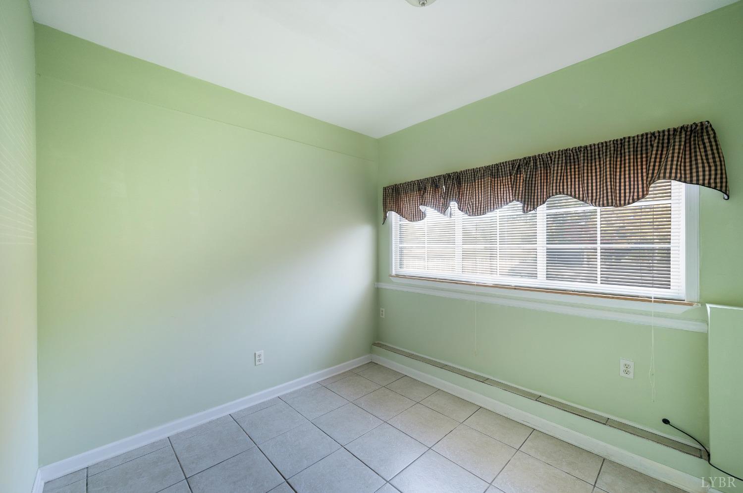 29 Dunivan Drive Rustburg, VA 24588 - Photo 49 of 61 a room with a large window and a wooden floor