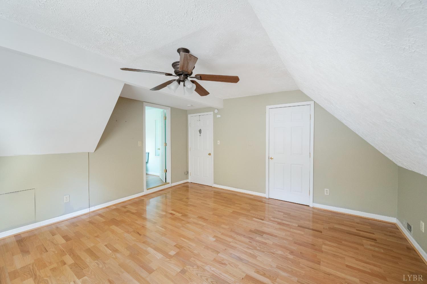 29 Dunivan Drive Rustburg, VA 24588 - Photo 54 of 61 a view of a big room with wooden floor and a chandelier fan