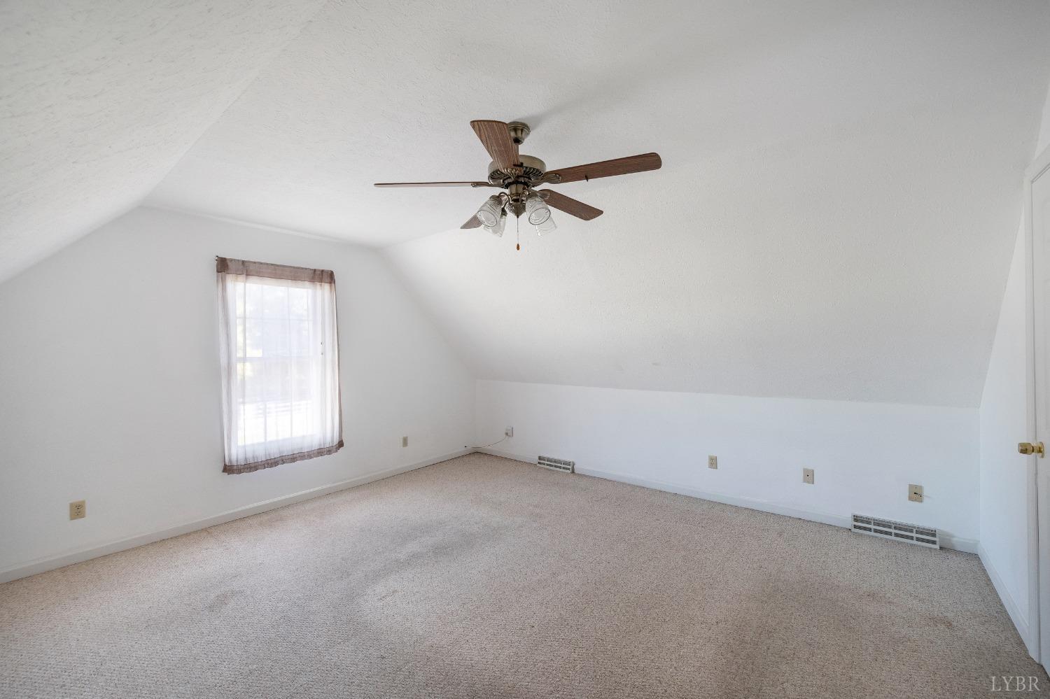29 Dunivan Drive Rustburg, VA 24588 - Photo 55 of 61 an empty room with a window and a ceiling fan