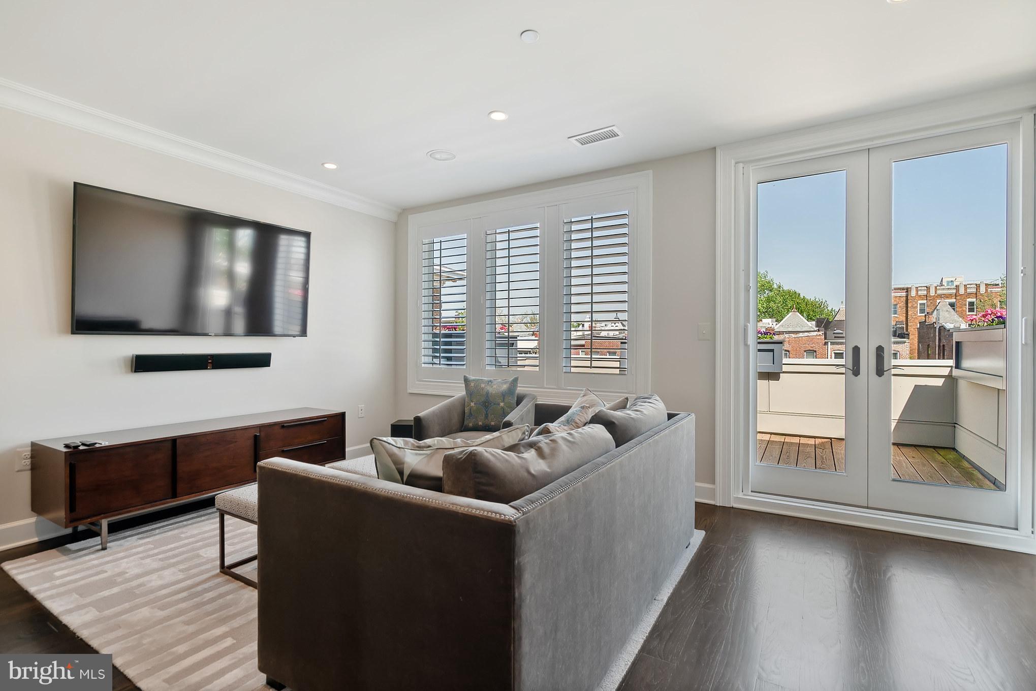 329 9th Street Northeast, Unit TH2 Washington, DC 20002 - Photo 19 of 29 Entertaining Area with Access to Rooftop Deck