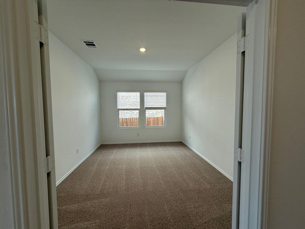 263 Magalia Lane Kyle, TX 78640 - Photo 12 of 37 a view of a hallway with a window