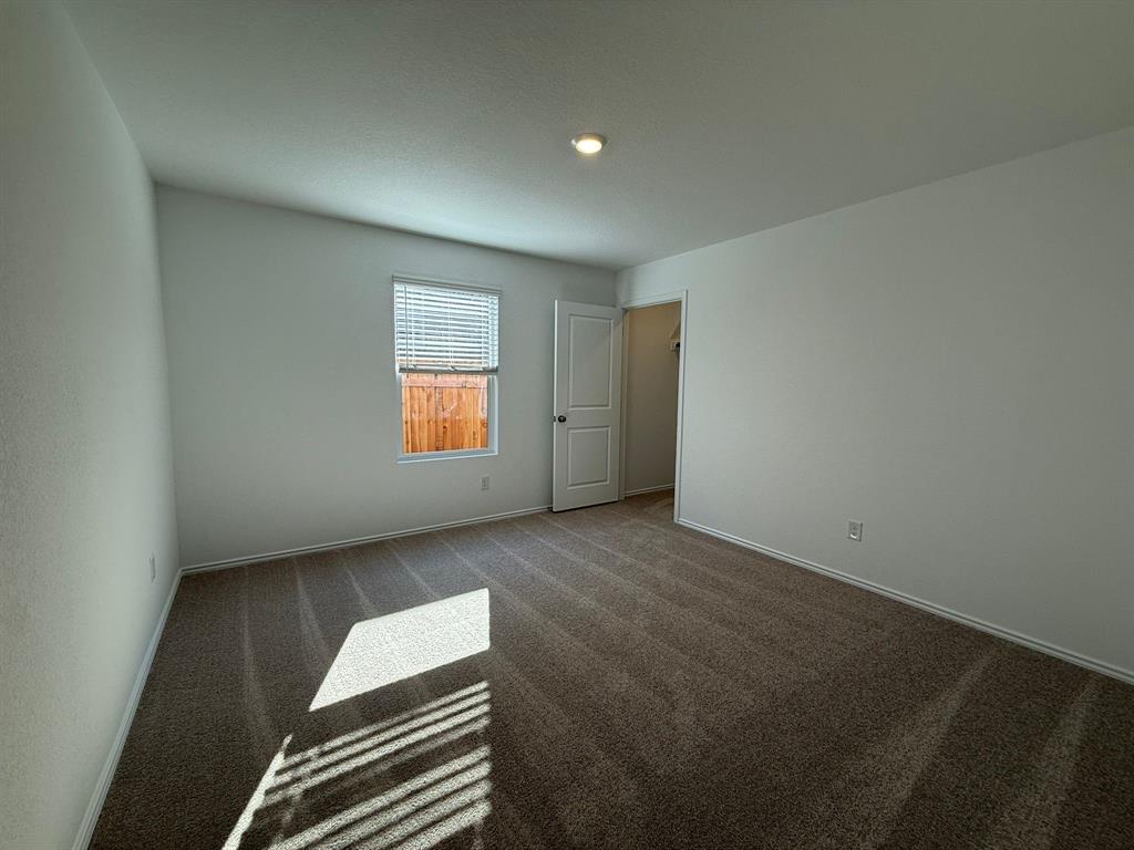 263 Magalia Lane Kyle, TX 78640 - Photo 14 of 37 an empty room with windows