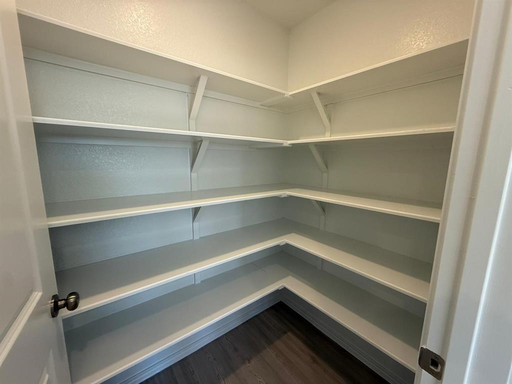 263 Magalia Lane Kyle, TX 78640 - Photo 20 of 37 a refrigerator in a kitchen
