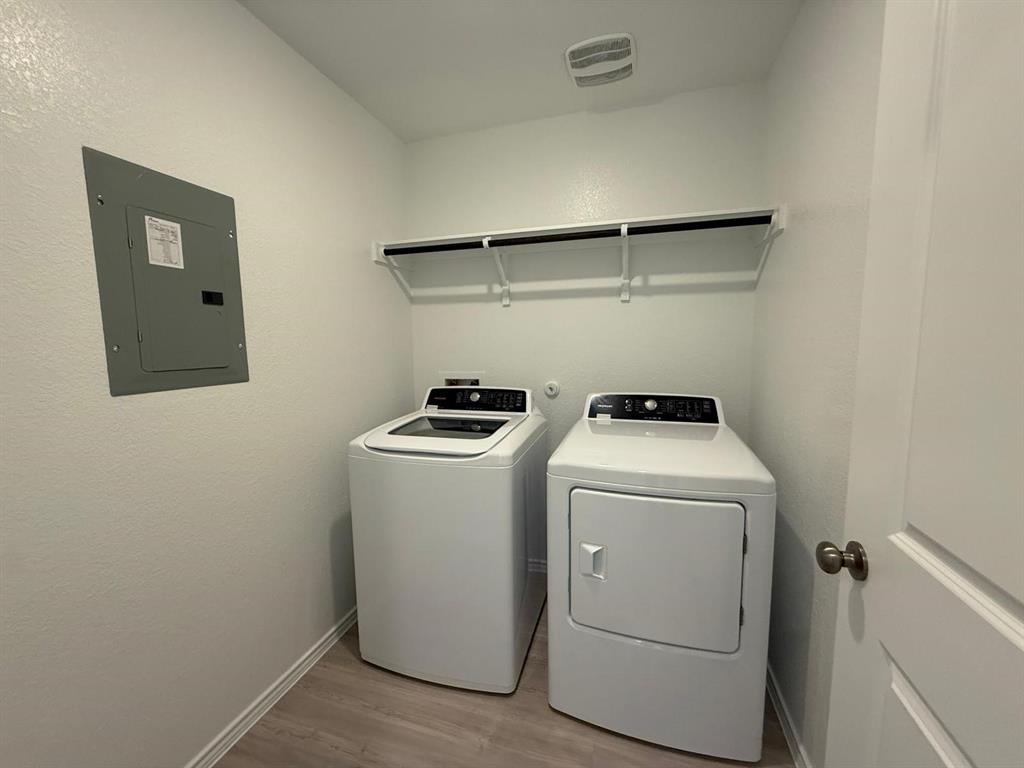 263 Magalia Lane Kyle, TX 78640 - Photo 22 of 37 a view of storage and utility room with washer and dryer