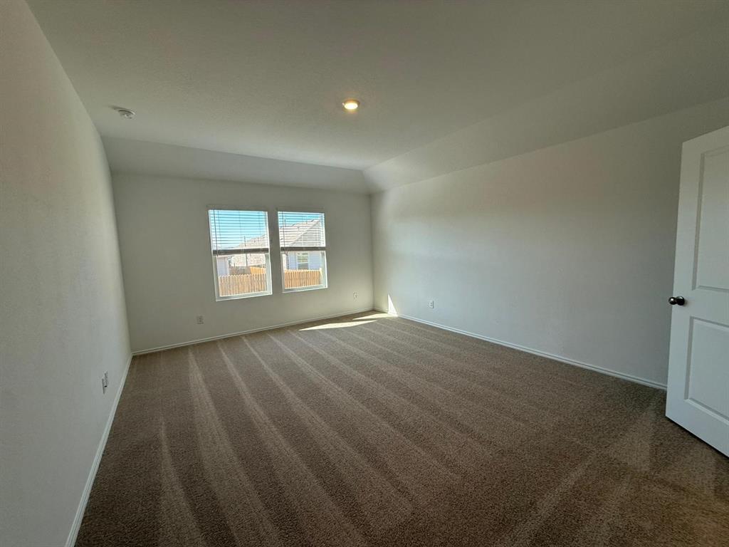 263 Magalia Lane Kyle, TX 78640 - Photo 24 of 37 an empty room with windows