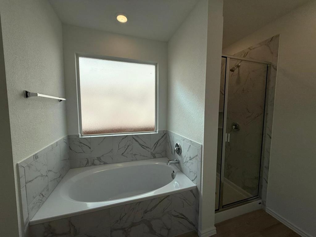 263 Magalia Lane Kyle, TX 78640 - Photo 28 of 37 a bath tub sitting next to a window