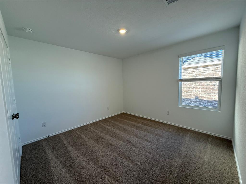 263 Magalia Lane Kyle, TX 78640 - Photo 8 of 37 an empty room with a window