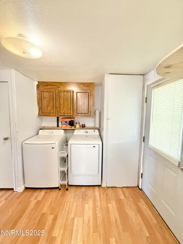 a view of a storage & utility room with washer and dryer