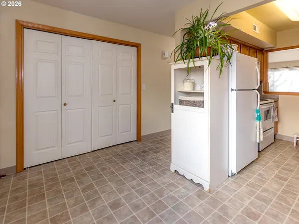 a kitchen with a refrigerator a stove and a sink