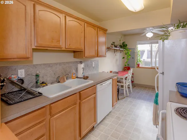 a kitchen with a stove and a sink